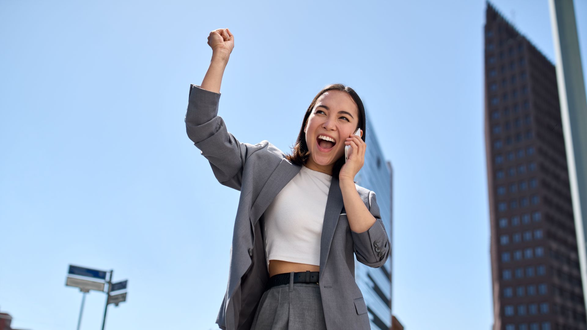 young cheerful asian businesswoman talking on cell 2022 08 29 21 36 05 utc