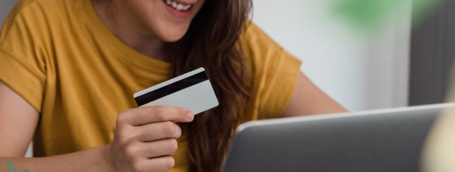 happy young woman shopping online with credit card 2021 09 02 10 36 20 utc 1